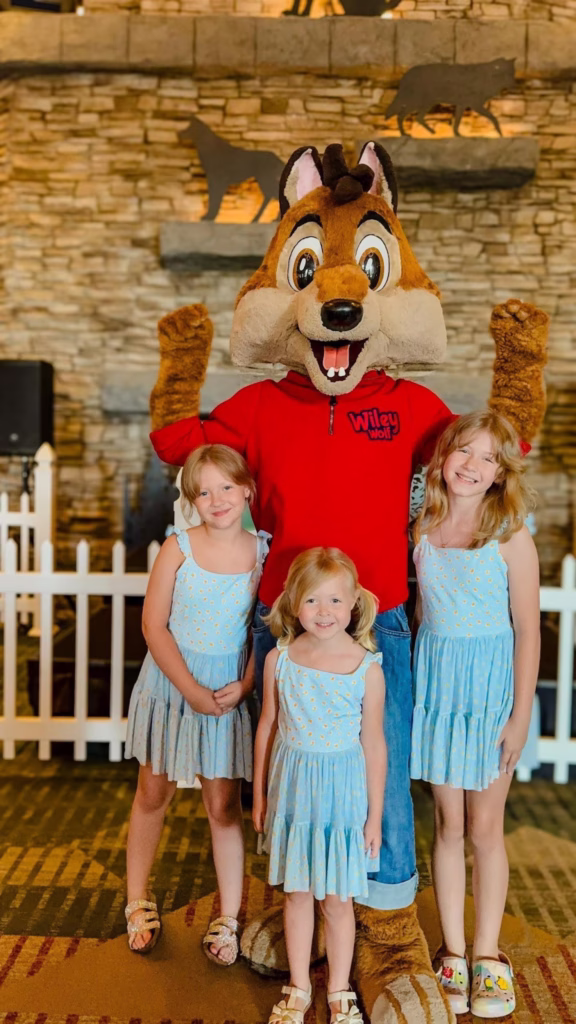 Kids pose with Wiley the Wolf at the Great Wolf Lodge