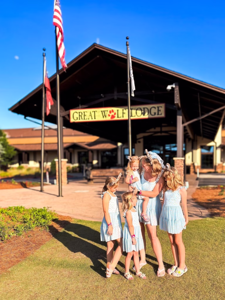A happy family outside of the Great Wolf Lodge