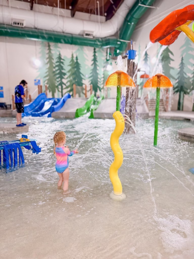 Girl playing in the splash area at the indoor water park at Great Wolf Lodge
